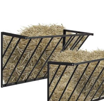 Two metal hay racks with hay on a white background