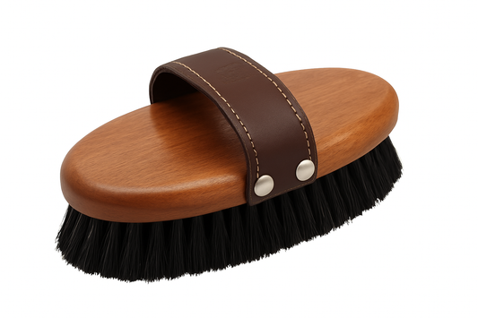 Wooden brush with brown handle and black bristles on a white background